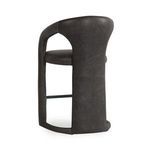 Rear view showing fully upholstered back panel in distressed leather and rounded lower frame