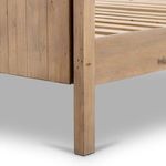 Close-up of bed leg and sideboard joint with visible wood grain and distressed markings