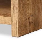 Close-up on leg and side panel junction highlighting texture and wood grain
