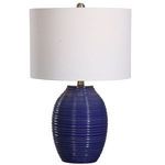 Ceramic table lamp with ribbed indigo blue base and white linen round drum shade with brushed nickel accents