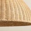 Close-up of the lower edge and weaving details of Mayla Rattan Pendant’s wicker shade