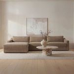 Farrow Sectional styled in light neutral room with abstract wall art and marble round coffee table