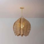 Softly lit pendant highlighting woven rope texture and warm tones in a room setting