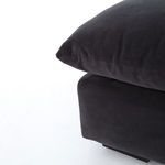 Zoomed detail of cushion corner and stitching on charcoal fabric with slight fabric texture visible