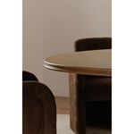 Styled Charles Dining Table in room setting with two brown upholstered chairs