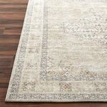 Detailed corner view focusing on the rug's finished edge and intricate border pattern