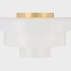 Side view of flush mount highlighting the brass mounting plate atop concentric white glass shades