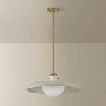 Gustavo pendant installed in a room with beige walls showing full hanging length and ceiling mount