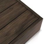 Detailed look at the slatted teak top with straight edges and rich brown coloration