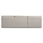 Rear elevation of two-piece beige sectional highlighting clean boxy frame