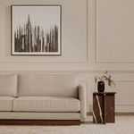 Vernon sofa in styled living room setting with side table and modern wall art