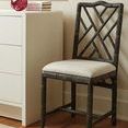 Hampton Side Chair styled in a light room next to an off-white dresser with books and a red vase