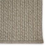 Detailed close-up showing distinct braided pattern and weave on flattened rug surface