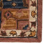 Extreme close-up of edge highlighting texture and woven floral border detail