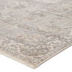 Repeat of top-side corner of rug flipped over revealing plain cream underside