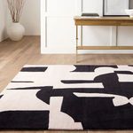 Side angle of rug in minimalist room emphasizing soft texture and large abstract shapes