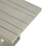 Close-up of bench end showing slat edges and slight weathered wood variations