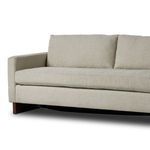 Low angle front view focusing on seat cushion and cocoa brown ski leg