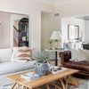 Bianca Rectangle Tray styled on wooden coffee table in modern living room with sofas, lamp, and plants
