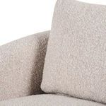 Close-up of square loose back cushion showing textured upholstery fabric