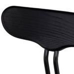 Close-up of wood grain texture on the chair's curved black backrest