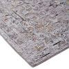 Close-up of rug corner showing low pile texture and detailed medallion pattern with orange and gray accents