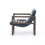 Profile view showing curve of seat and backrest supported by rectangular wood frame