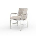 Sabbia Dining Chair shown from a left-front angle highlighting rounded tube frame and armrest rope details
