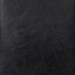Straight-on view of Elyse Ottoman with visible polished nailhead trim along leather seat perimeter