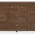 Front view of dresser emphasizing symmetrical drawer layout with brass hardware