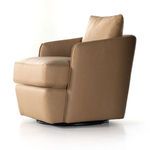 Side angle showing smooth leather upholstery and curved back of swivel chair