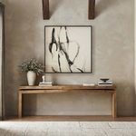 Another view of the painting in rustic room setting showing organic decor and wooden beams
