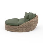 Side profile of round daybed showing sloped back and split cushion seating in olive green