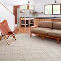 Sawyer Silver Rug shown in modern kitchen living area with wood floor and furniture