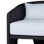 Close-up of black all-weather wicker armrest and white back cushion seam