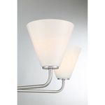 Close-up detail of two white strie glass shades and satin nickel arms of Blair chandelier