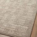 Angled view of rug corner emphasizing the neutral palette and ribbed, dimensional weave