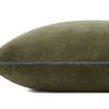 side view of olive green velvet pillow showing thickness and smooth texture of piped edge
