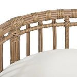 Close-up of rounded corner wicker weave on the top rail of the chair frame