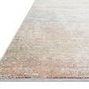 Close-up angled corner view of Lucia Mist Rug showing pile texture and edge binding on a white backdrop