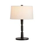 Fernando Table Lamp illuminated showing warm glow through white shade on white background