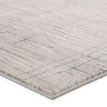 Close-up of rug edge showing high-low pile texture and detailed linear pattern