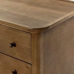 Lip edge detail around the full perimeter of dresser top, showing precise craftsmanship
