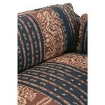 Macro view of sofa fabric pattern showing abstract geometric shapes and woven texture