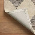 Close-up section of Francis rug showing alternating beige and charcoal diamonds with wool loops