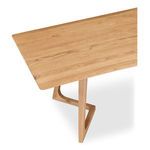 Close-up angled view of tabletop corner and part of supporting leg