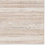 Top corner view highlighting the rug’s carved high-low abstract pattern and edge stitching