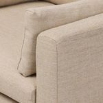 Close-up showing boxed arm cushions with knife-edge seam detail on wheat fabric