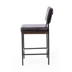 Side profile of Benton Stool highlighting seat thickness and backrest attachment