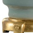 Close-up of Emma Lamp showing antique gold leaf finished footed base with textured details